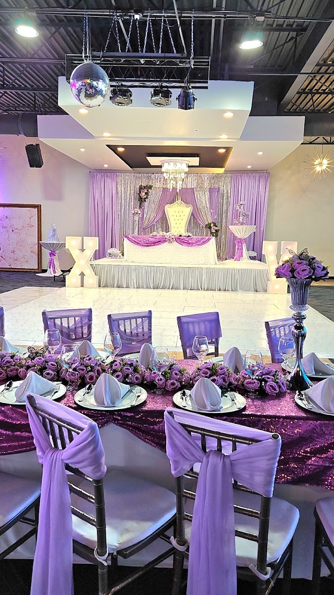 Purple and silver quinceañera stage with an ivory throne, disco ball and XV marquee letters at Silverstar Event Center in Lewisville, TX