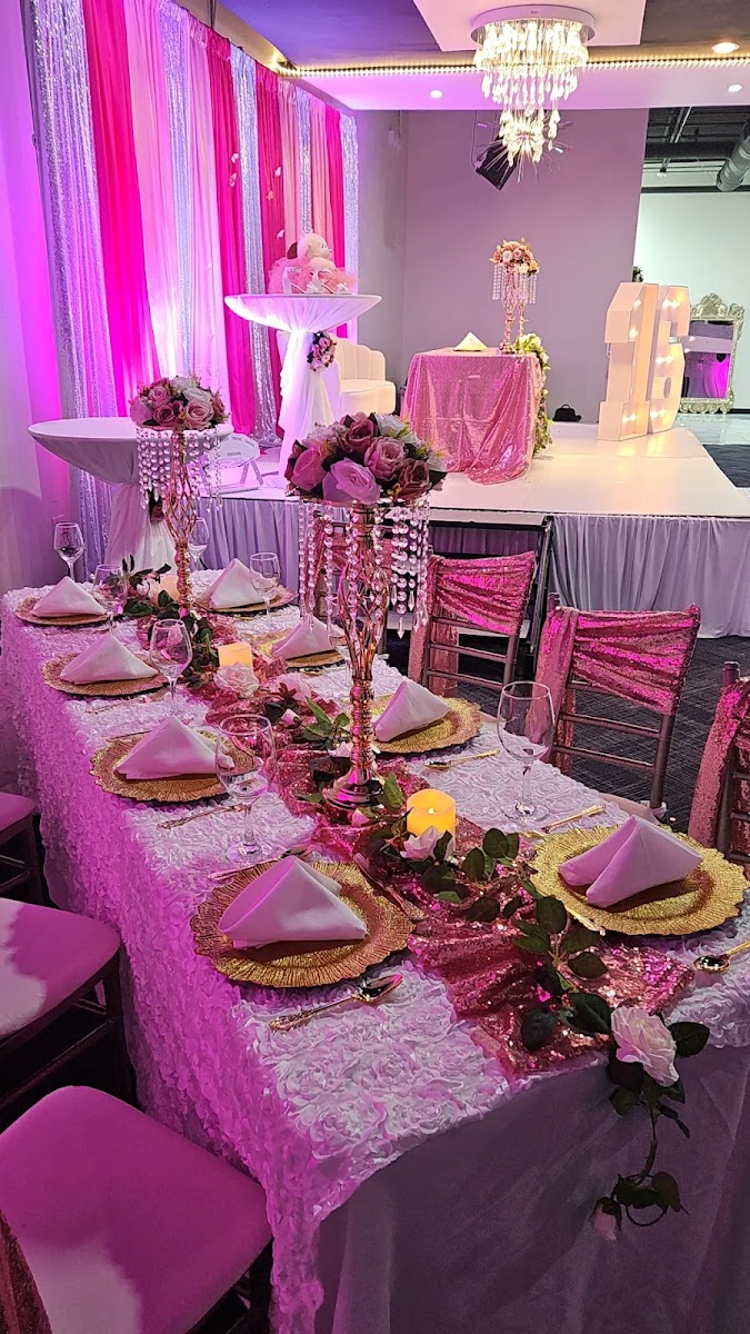 Pink and gold quinceañera table setting with sequin runner and rose centerpieces at Silverstar Event Center in Lewisville, TX