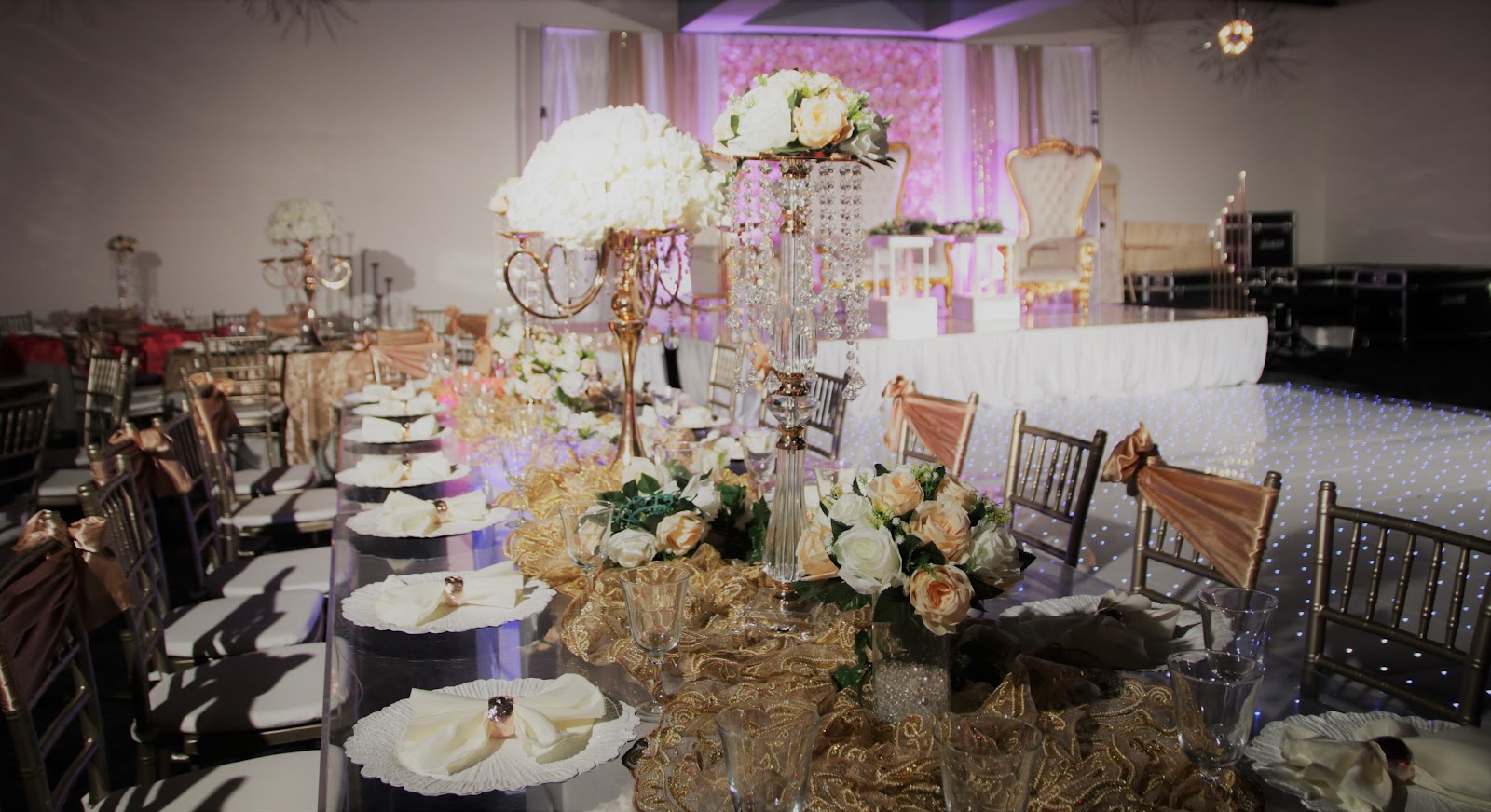 White hydrangea on a gold candelabra with a burlap-toned table runner at Silverstar Event Center in Lewisville, TX
